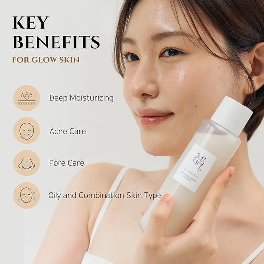Woman holding a skincare bottle with key benefits for glow skin displayed.