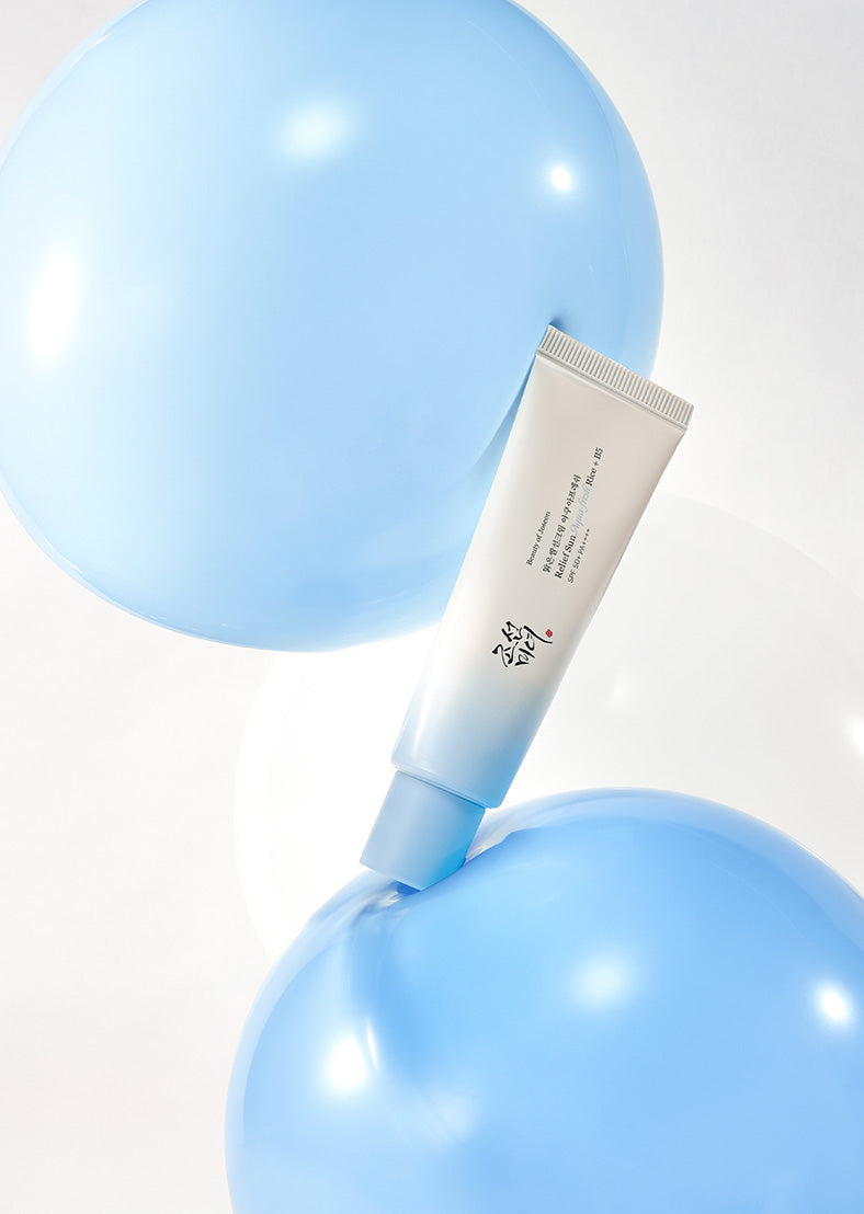 Tube of cream on a blue balloon with a white background