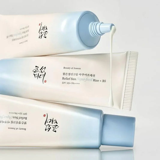 Three tubes of Beauty of Joseon skincare product on a light gray background
