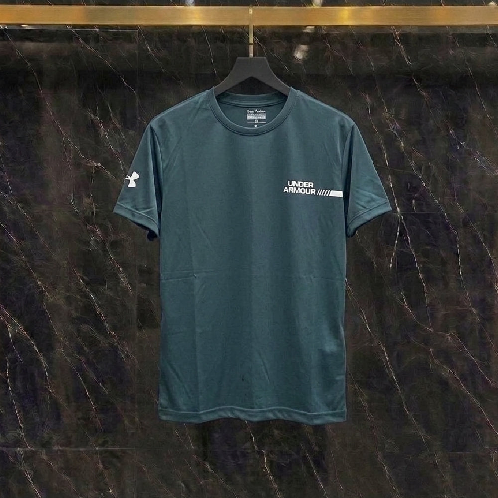 A dark teal Under Armour short-sleeve athletic t-shirt hanging on a black hanger against a dark marble-patterned wall.